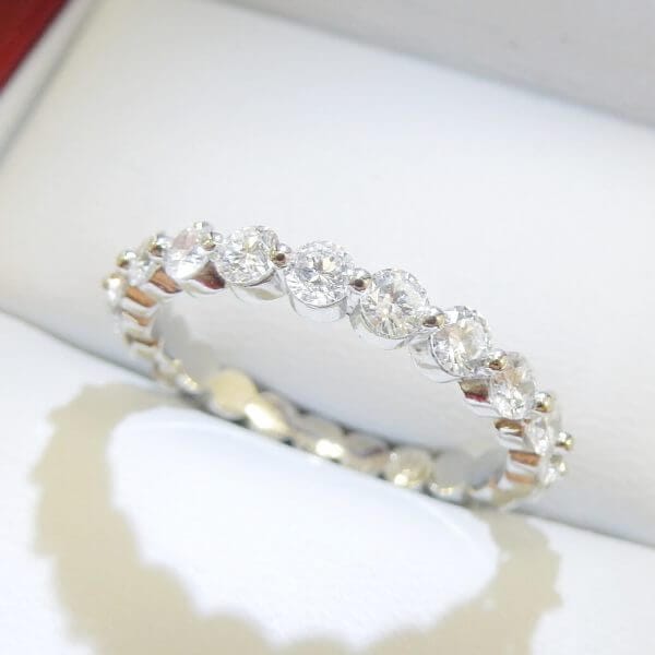 Floating diamond wedding band