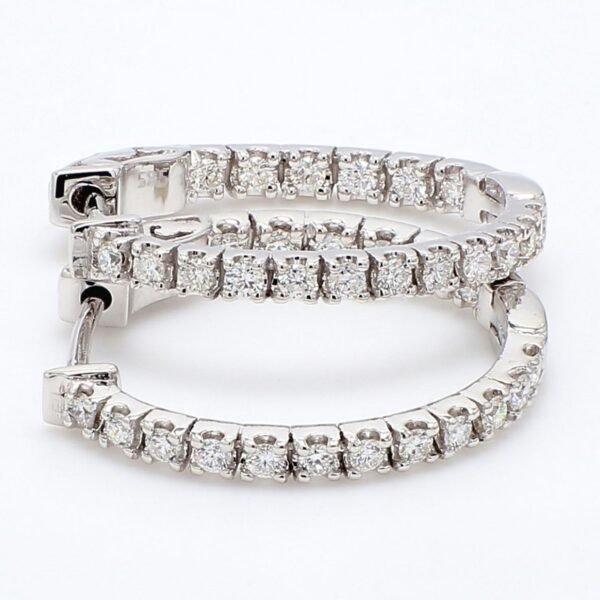 0.75' Oval shape inside out hoop earrings with 4-prong set round diamonds.  D0.79ct.t.w.