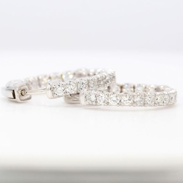 0.75' Inside out hoop earrings with 4-prong set round diamonds.  D1.04ct.t.w.