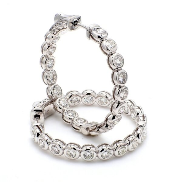 1.25' Inside out hoop earrings with bezel set (34) round diamonds & with special spring lock.  D3.26ct.t.w.