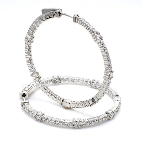 1.5' Inside out hoop earrings with 4-prong set (96) round diamonds & with special spring lock.  D2.68ct.t.w.