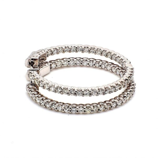 1.25' Inside out hoop earrings with U-prong set (74) round diamonds & with special spring lock.  D1.62ct.t.w.