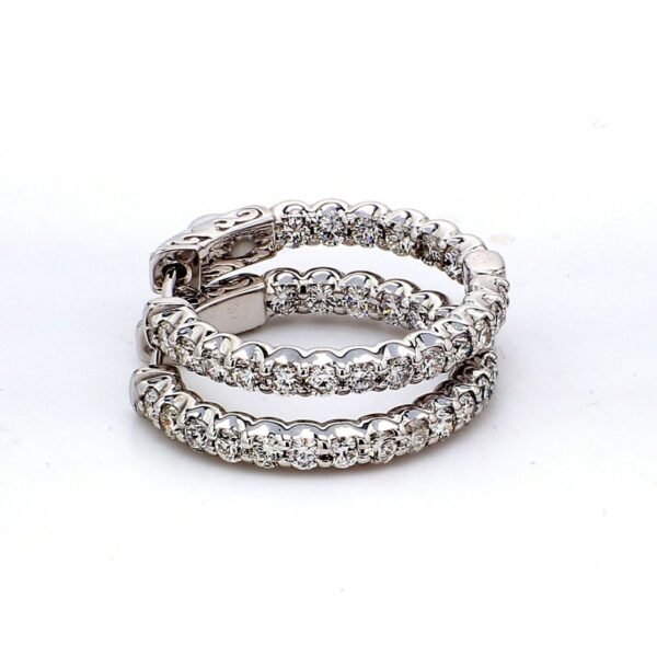 1' Inside out hoop earrings with shared prong set round diamonds.  D1.42ct.t.w.