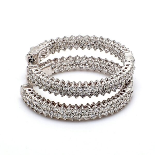 1.25' Inside out hoop earrings with 2-row prong set (146) round diamonds & with special spring lock.  D3.04ct.t.w.