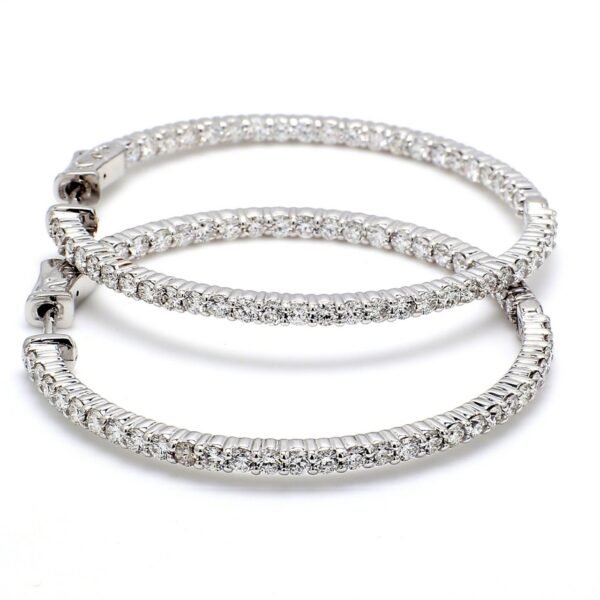 0.75' Inside out hoop earrings with shared prong set round diamonds & with special spring lock.  D1.09ct.t.w.