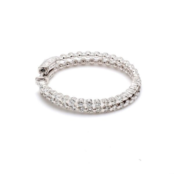 0.75' Inside out hoop earrings with 4-prong set (50) round diamonds & with special spring lock.  D0.53ct.t.w.