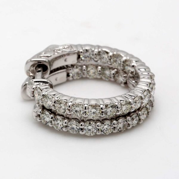 0.5' Inside out hoop earrings with prong set (30) round diamonds & with special spring lock.  D1.39ct.t.w.