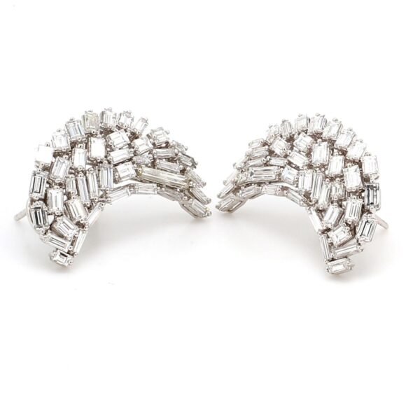 French clip earrings in half moon shape with baguette prong set diamonds in free style design.  D4.18ct.t.w.