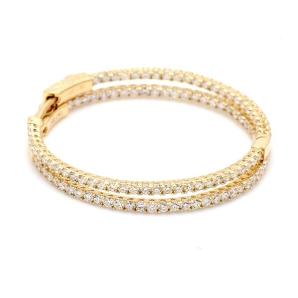 1.5' Inside out hoop earrings with prong set round diamonds.  D1.83ct.t.w.