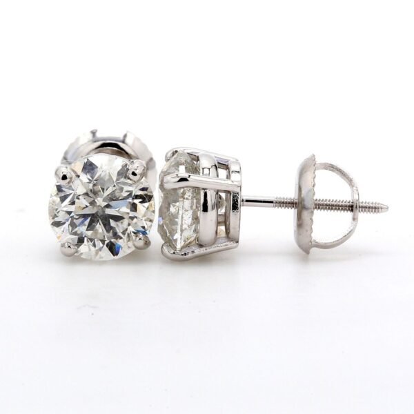 Screw back stud earrings with 4-prong set round diamonds.  D0.60ct.t.w.