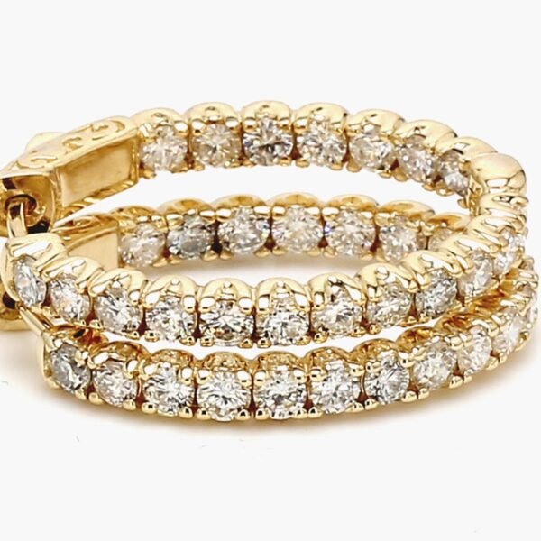 1' Oval shaped inside out hoop earrings in 14K YG with prong set round diamonds.  D2.66ct.t.w.