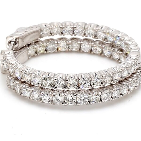 1' Inside out hoop earrings with prong set (54) round diamonds.  D2.69ct.t.w.