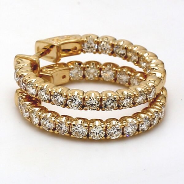 1' Inside out hoop earrings in yellow gold with prong set (38) round diamonds.  D2.36ct.t.w.