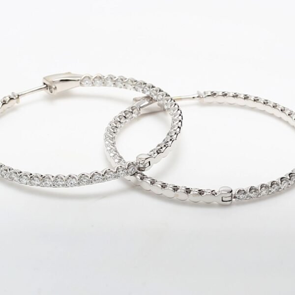1.50' Inside out hoop earrings with U-prong set (90) round diamonds.  D2.77ct.t.w.