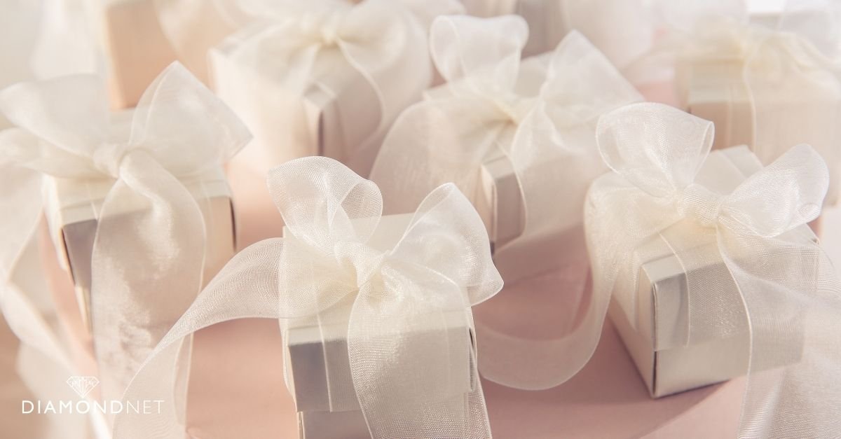 A woman displays a gift box, ideal for a bridesmaid proposal gift