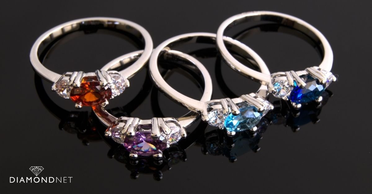 A collection of rings with colourful gemstones, showcasing the latest trends in jewellery