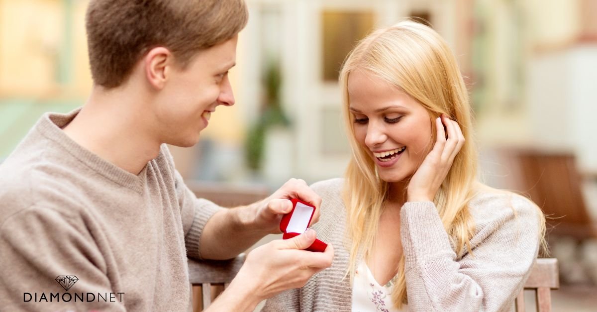 A couple at a table, suggesting a significant moment for a proposal.