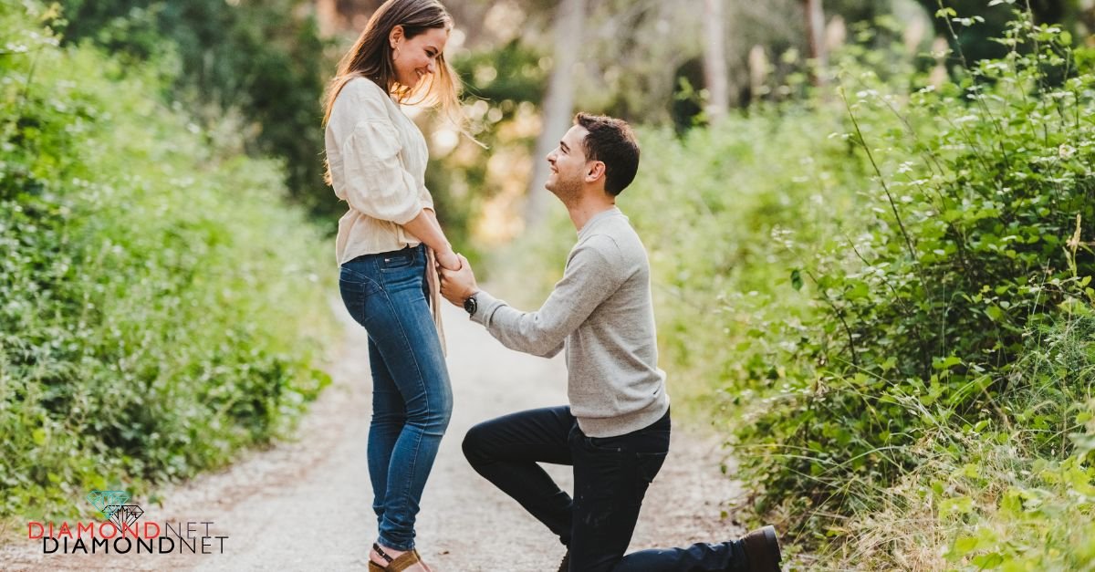 A woman kneels in a field to propose to his boyfriend, highlighting their commitment and readiness for engagement