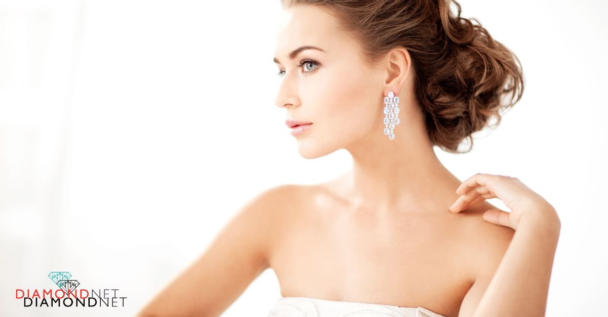 A bride adjusts her diamond earrings, carefully choosing the ideal pair for her wedding ceremony.