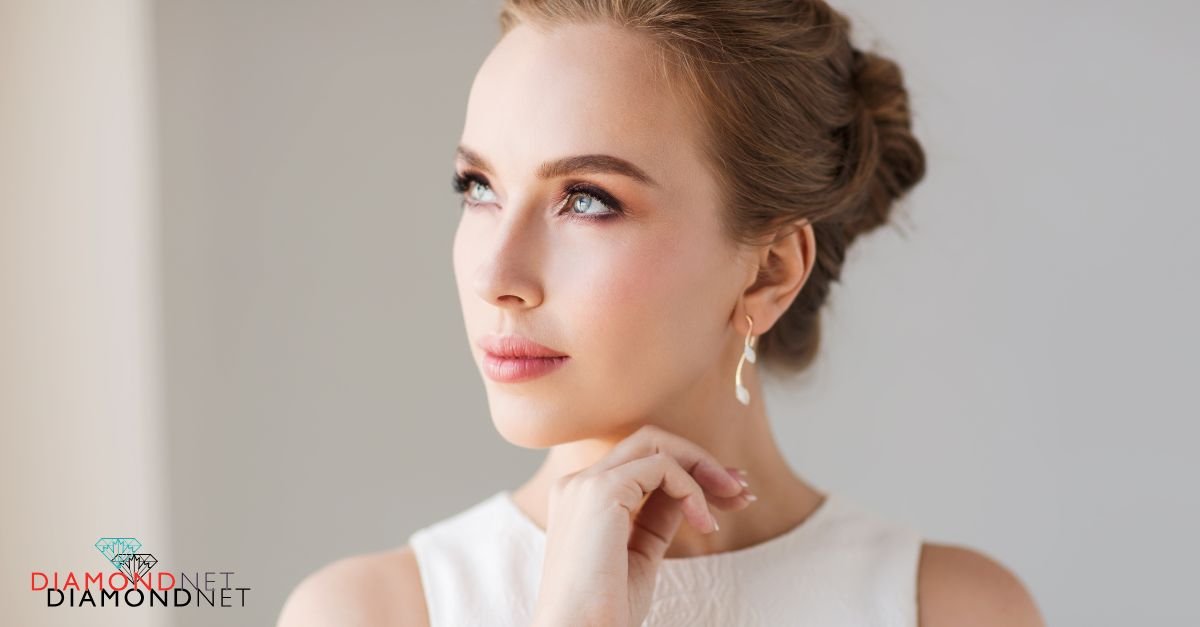 A bride in a stunning wedding dress adorned with Canadian diamond earrings, highlighting her special day
