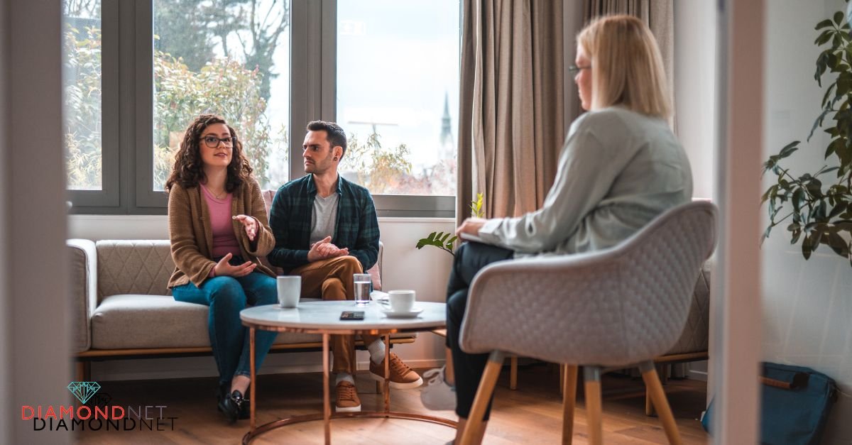 A young couple engages in conversation with a therapist, exploring their relationship and readiness for engagement