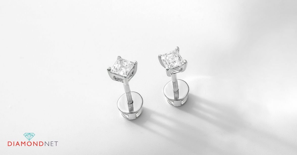 A person cleaning a diamond earring with a cloth, highlighting the importance of jewellery care and maintenance