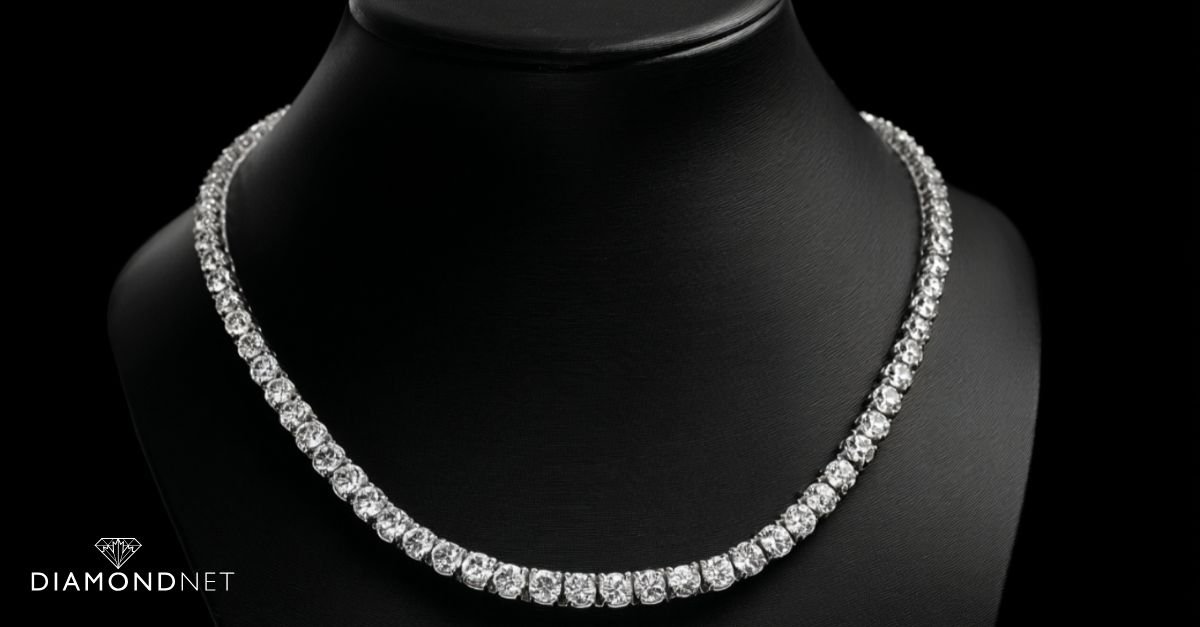 A woman wearing a diamond tennis necklace with black dress