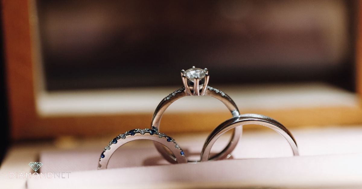 A woman inspecting a pavé engagement ring closely
