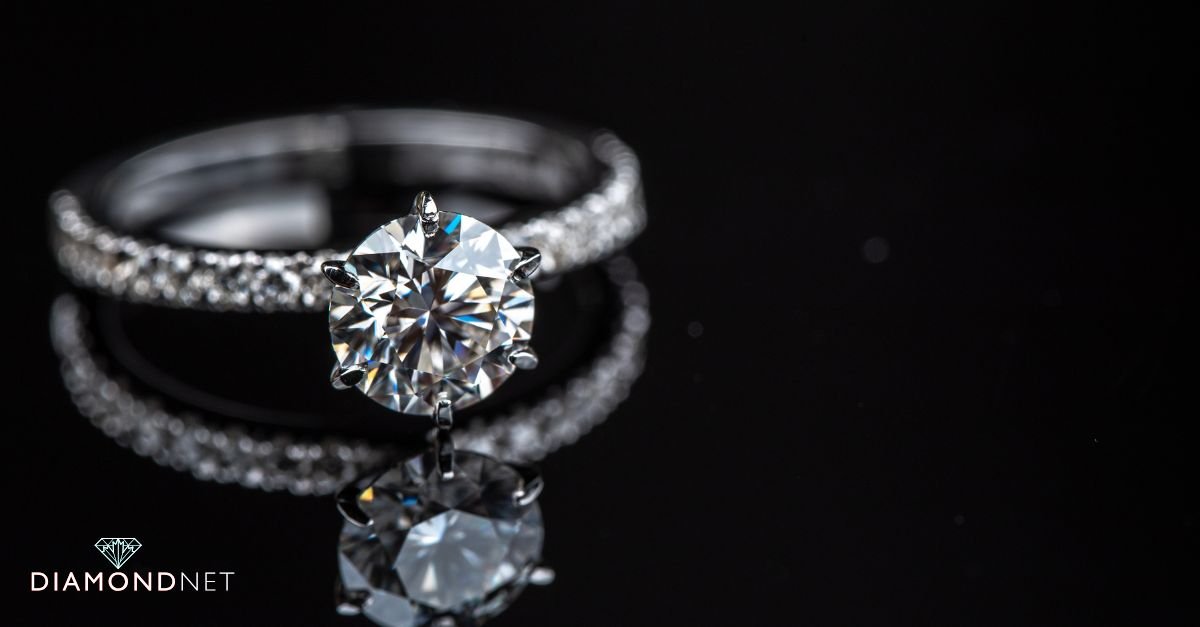 A woman viewing different engagement ring styles at a jewellery counter
